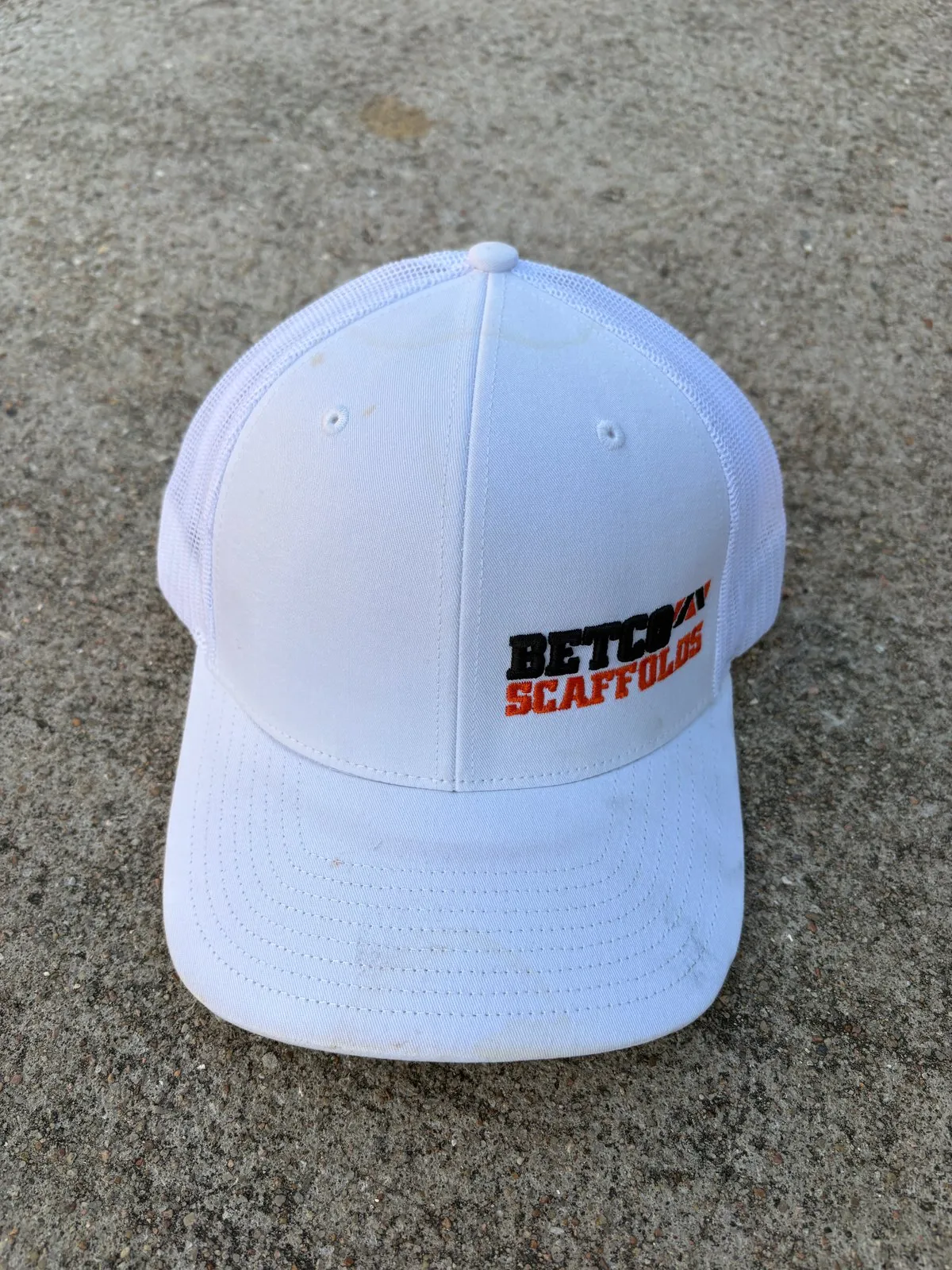Retired white Betco Scaffolds hat